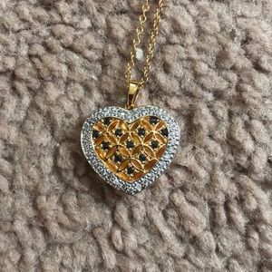 The Danbury Mint gold heart grandaughter necklace.